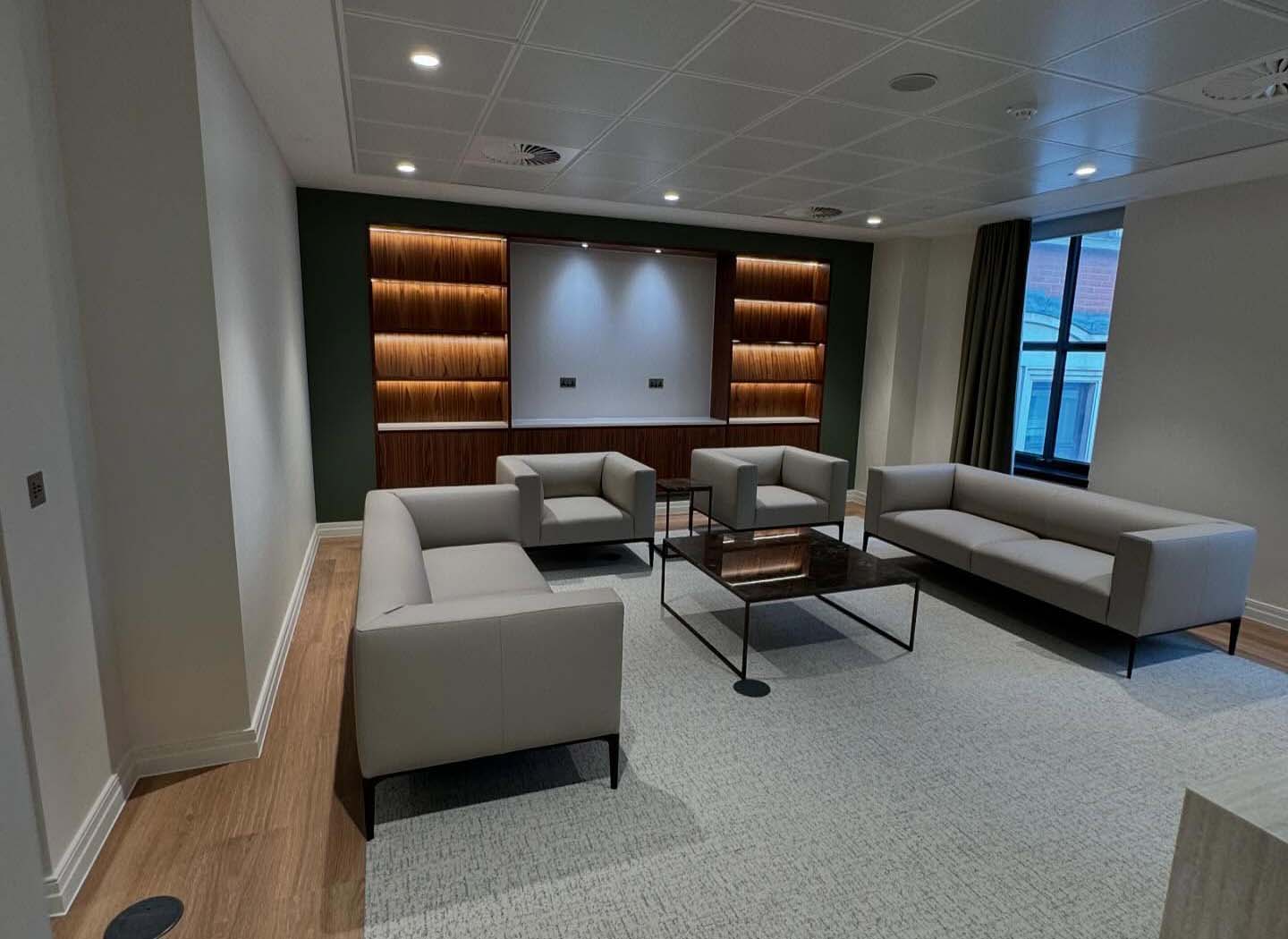 Fitted media wall with downlights in reception area in Rochester, Kent