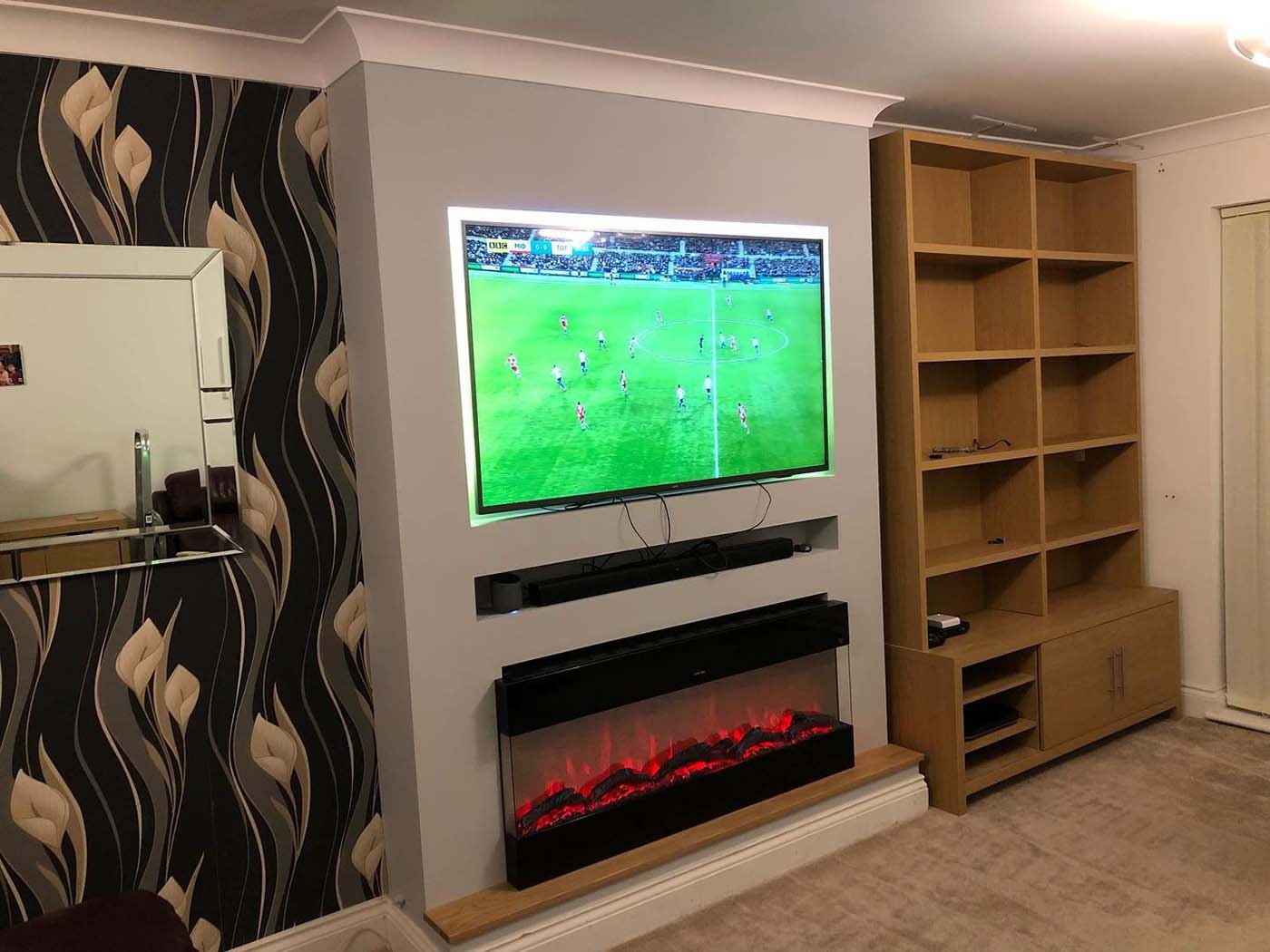 Media wall with football on the TV in Rochester, Kent