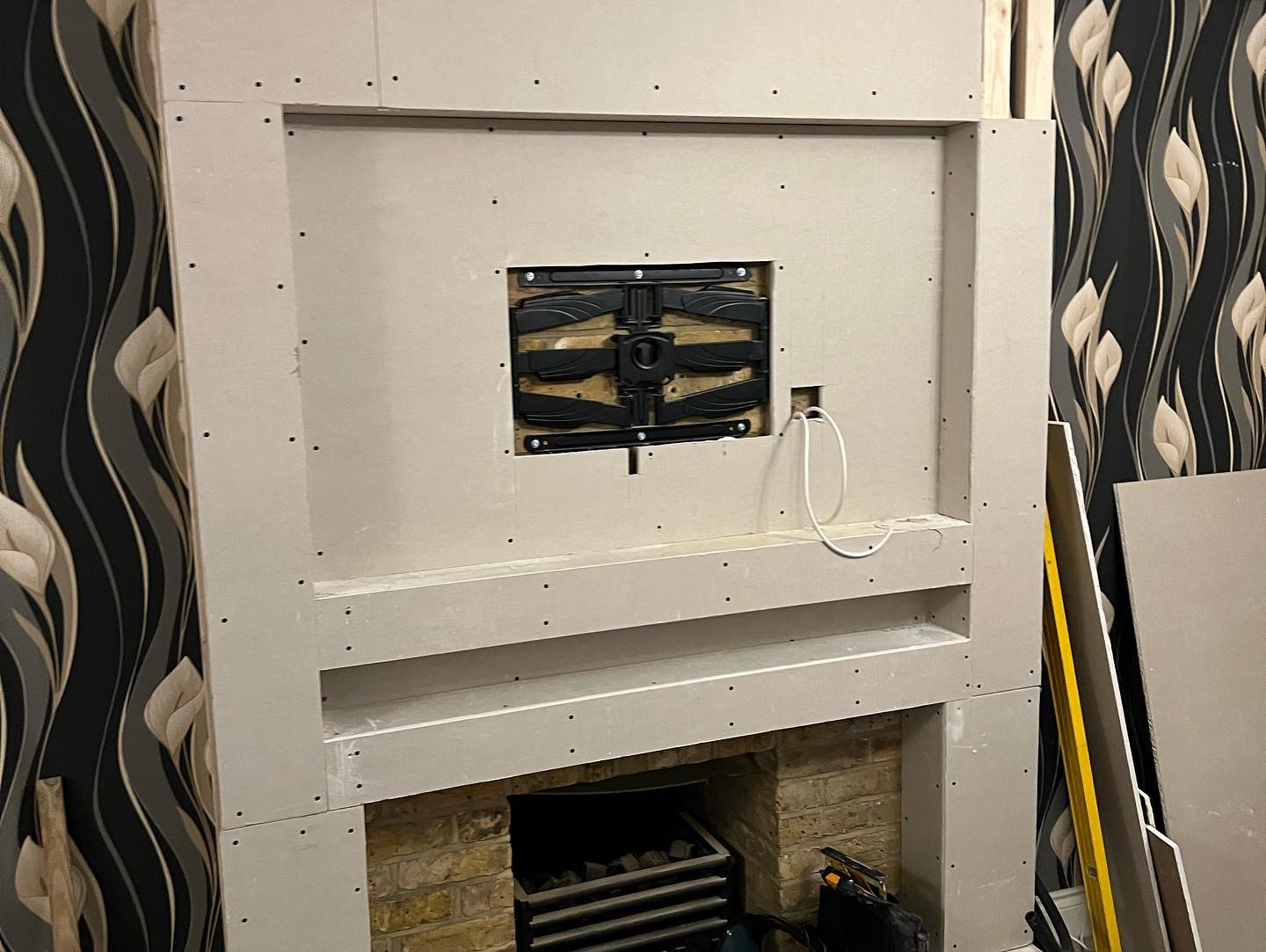 Process of media wall with plaster board with exposed wires in Rochester, Kent