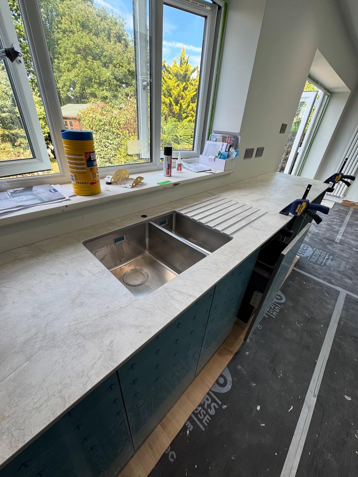Fitted chrome sink fitted into a marble-style worktop in Rochester, Kent