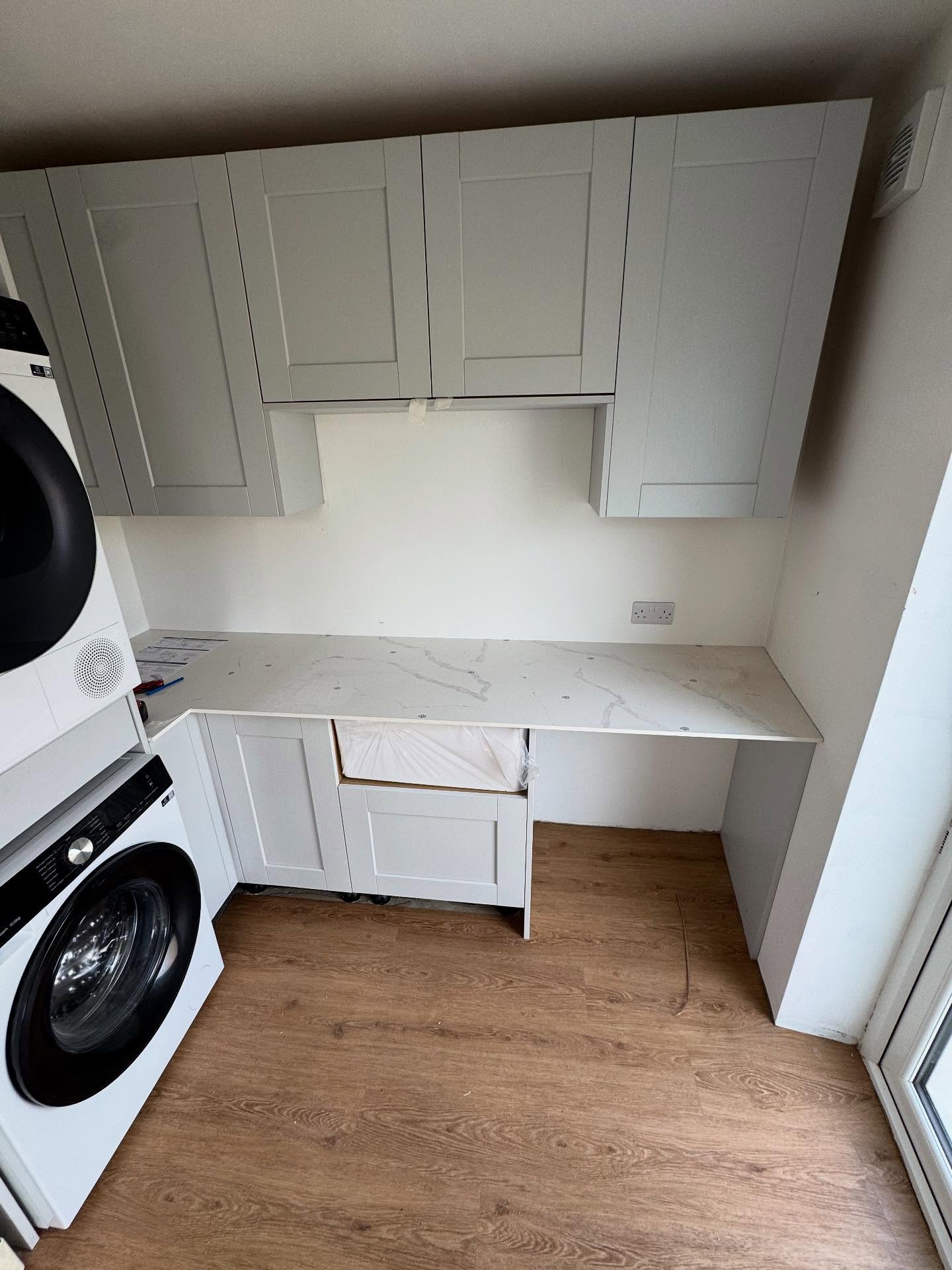 Fitted cupboards in a utility room in Rochester, Kent