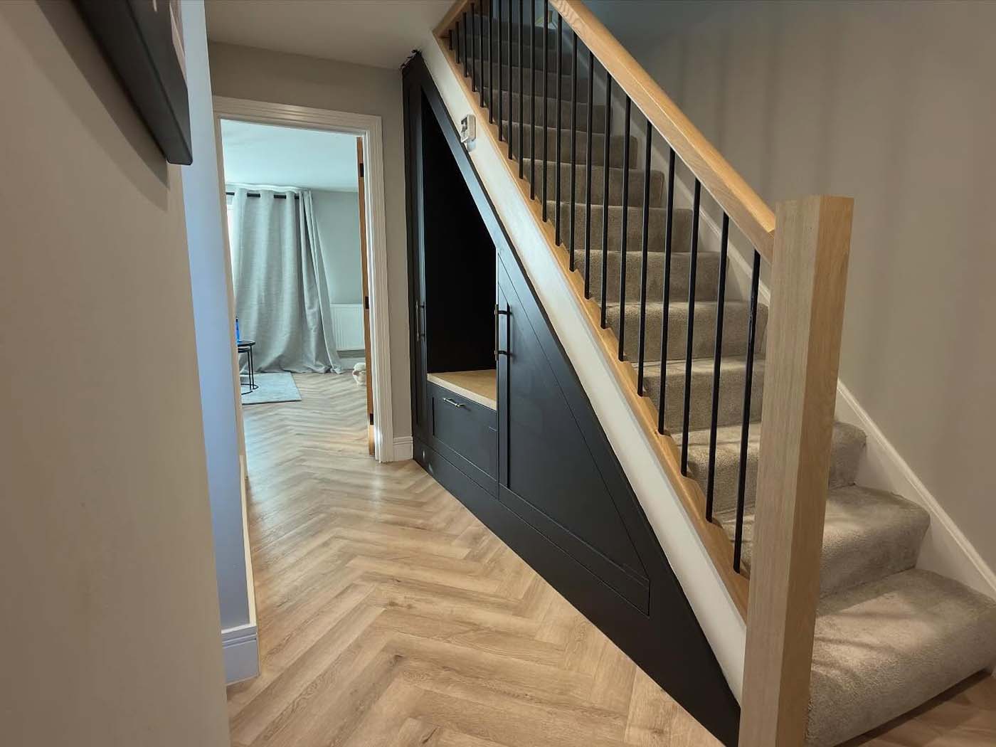 Staircase with fitted storage under in Rochester, Kent